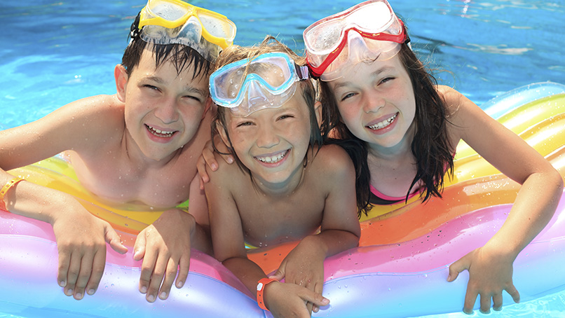Children playing in a resort pool